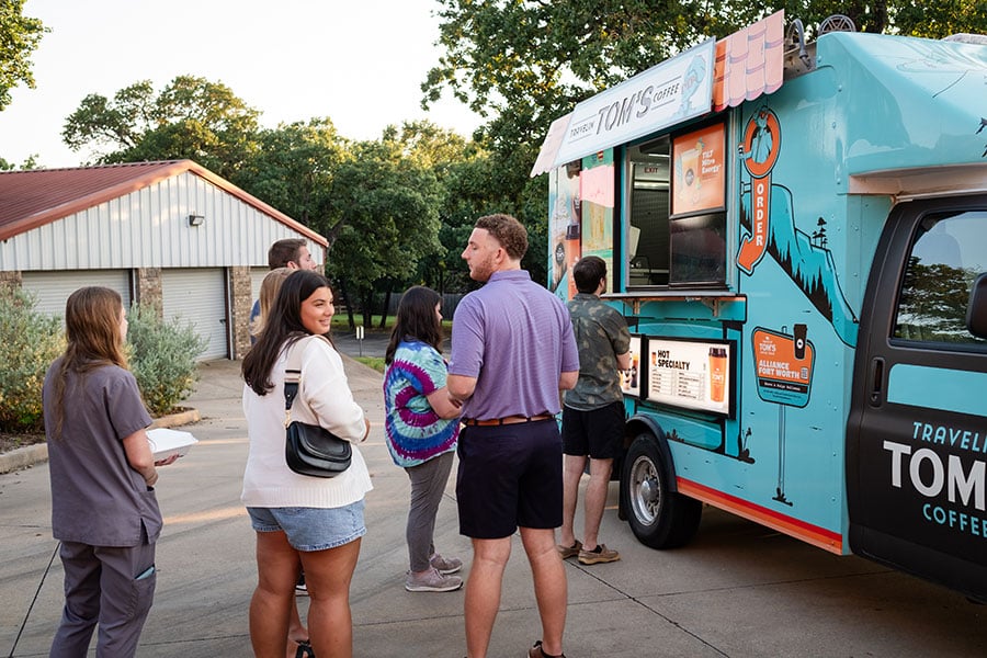 young adults delight in food trucks and fellowship
